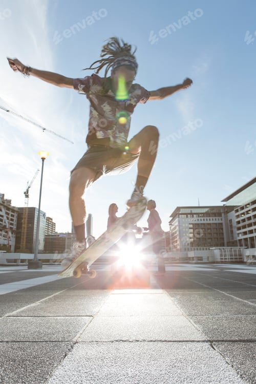 Preview: Young Man In Urban Area Performing Skateboarding Trick