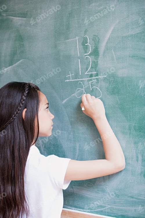 Preview: Girl Writing A Sum On A Blackboard