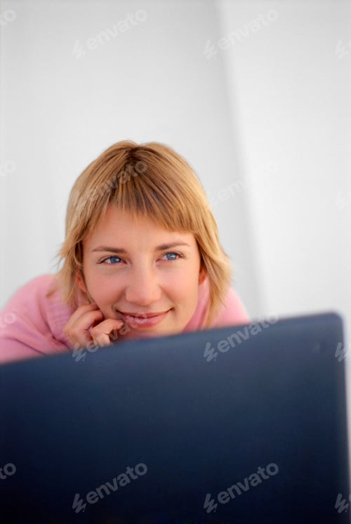 Preview: Smiling Woman Sitting At Laptop