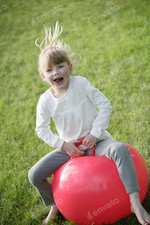 Preview: Child Jumping On Red Ball