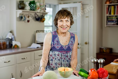 Preview: Senior Woman In Kitchen With Fruit And Vegetables