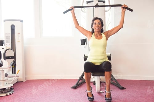 Preview: Mature Woman At Gym On Exercise Machine