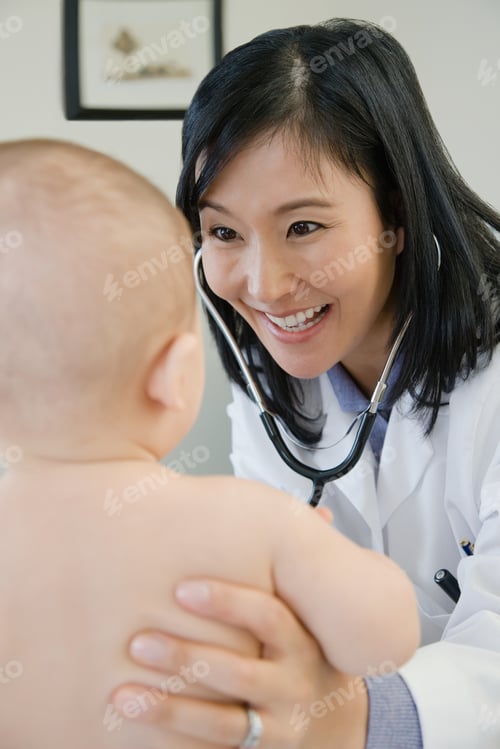 Preview: Doctor Examining A Baby