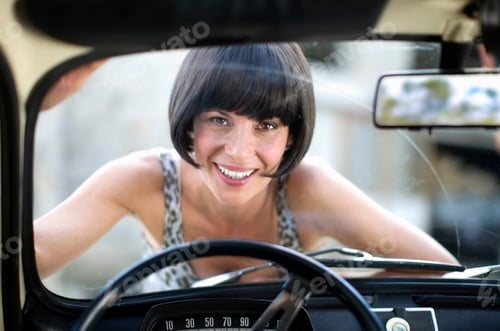 Preview: Woman Laying On The Front Of A Car
