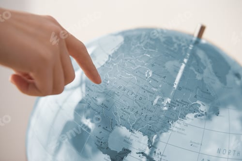 Preview: Person Pointing At A Globe