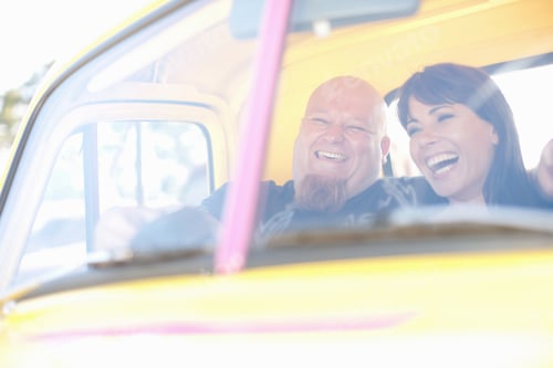 Preview: Couple Laughing In Colorful Car