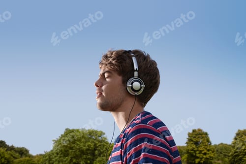 Preview: Boy Listening To Headphones