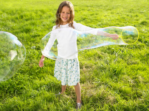 Preview: Little Girl Making Soap Bubbles
