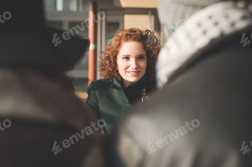 Preview: Over The Shoulder View Of Young Adult Friends Chatting In Cafe