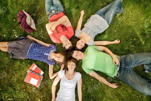 Preview: Five Students Relaxing In A Park