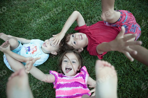 Preview: Children Playing In Grassy Field