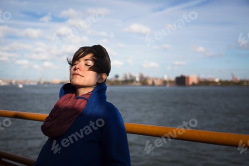 Preview: Woman On Ferry In Urban Harbor