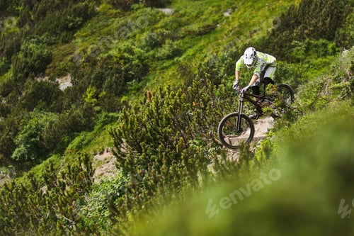 Preview: Mountain Biker Riding Down Steep Hill Path