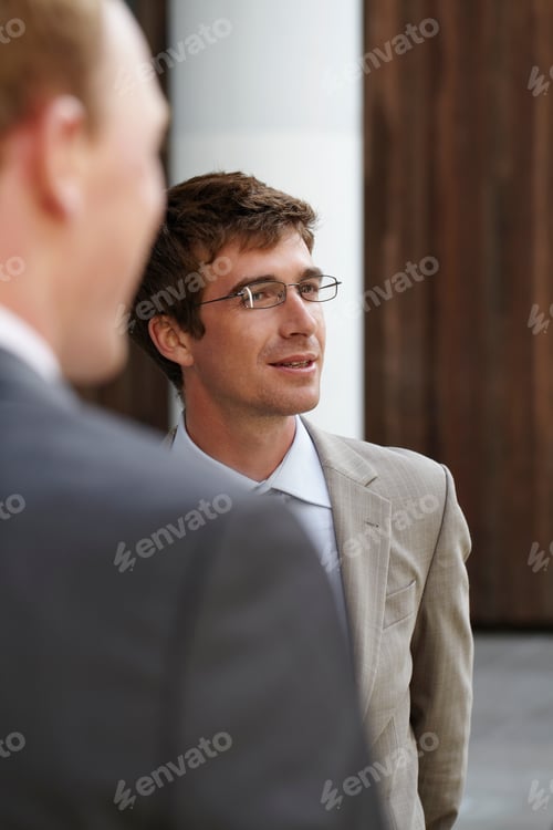 Preview: Businessmen Standing In Courtyard