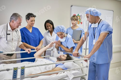 Preview: Doctors And Nurses Surrounding Patient In Hospital Bed