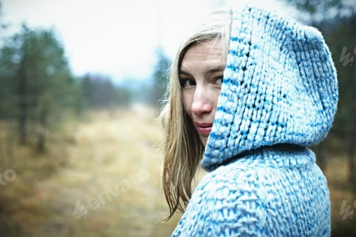Preview: Woman Wearing Hooded Top In Forest