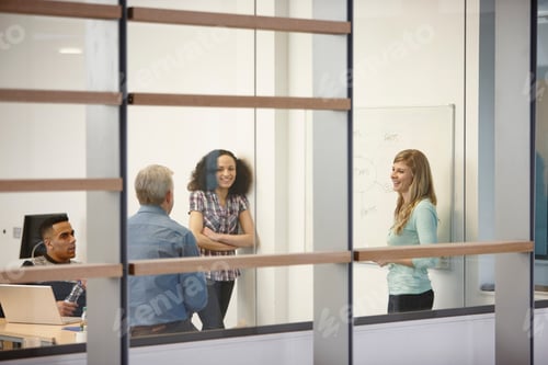 Preview: Businesswoman Making Team Presentation On Office Whiteboard