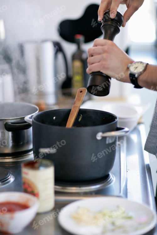 Preview: Man Grinding Pepper Into Pot
