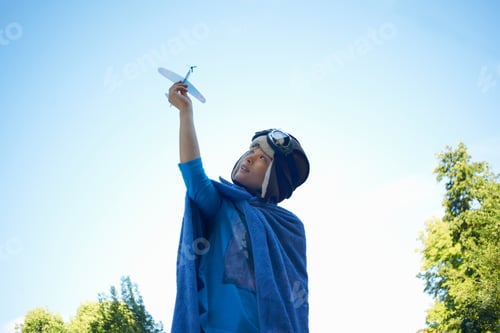 Preview: Young Boy In Fancy Dress, Playing With Toy Aeroplane
