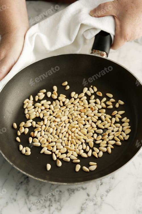 Preview: Chef Toasting Pine Nuts In Pan