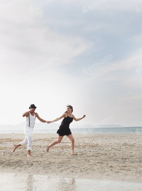 Preview: Couple Running On The Beach