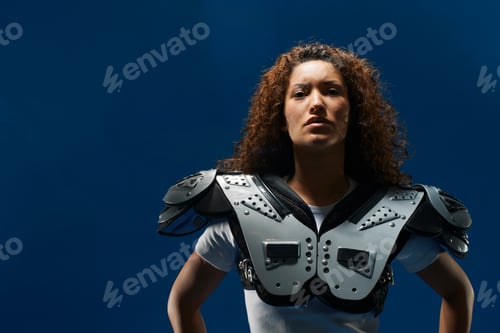 Preview: Portrait Of Female American Footballer Wearing Shoulder Pads