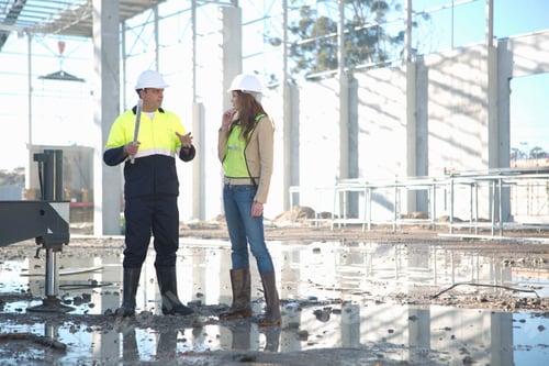 Preview: Site Manager And Architect Chatting On Construction Site