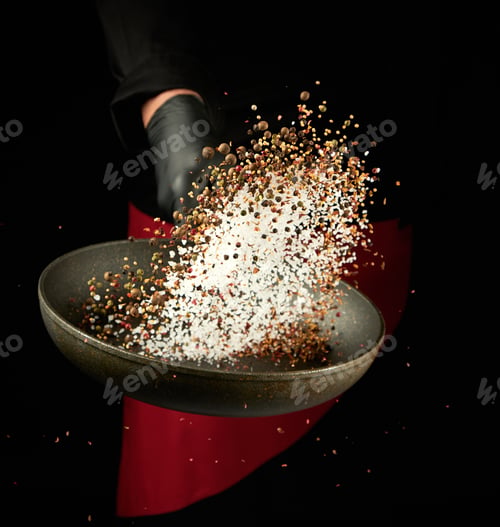 Preview: Chef Holds A Round Pan And Throws The Mixture Of Spices And White Salt Up, Low Key