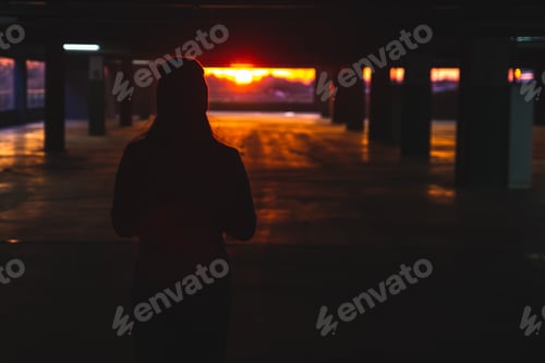 Preview: Woman Stand At Car Parking Look On Orange Sunset