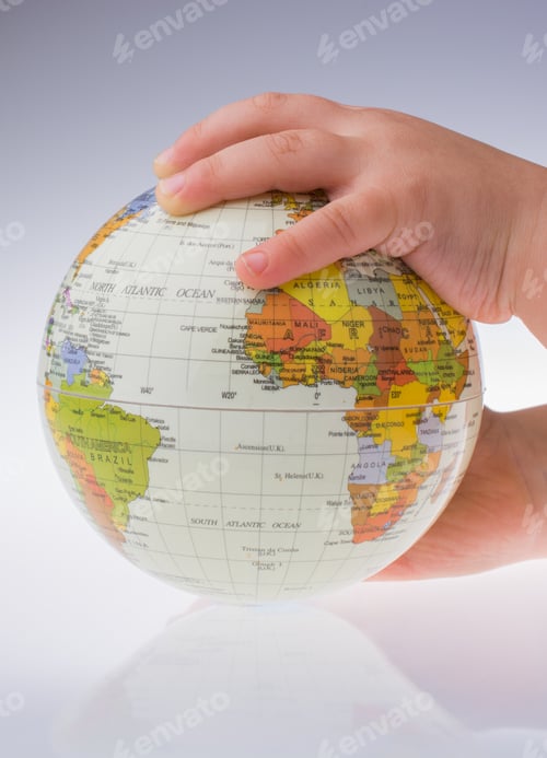 Preview: Child Holding A Globe In On A White Background