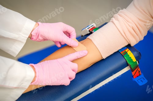 Preview: Close Up Of Nurse Hand Applying Adhesive Plaster On Arm Of Patient After Blood Collection In The