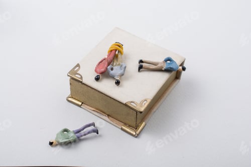 Preview: Tiny Figurine Of Men Model Tied In Rope Beside A Book
