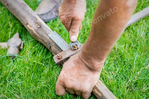 Preview: Hand Of An Elderly Man Twisting The Nut With A Wrench Outdoors. Repair By Wrench.