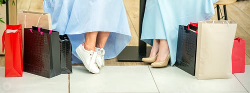 Preview: Crop Shot Of Female Legs With Shopping Bags In Cafe Of The Shopping Mall