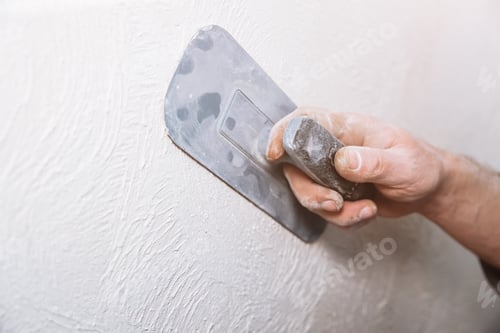 Preview: Man Is Priming A Surface With A Sandpaper. Grind Of Wall. Maintenance Repair Works Renovation In