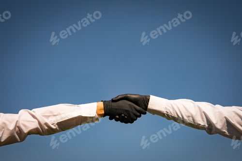 Preview: Handshake With Black Medical Gloves, Profile View On Blue Background. Covid-19 Coronavirus Ncov