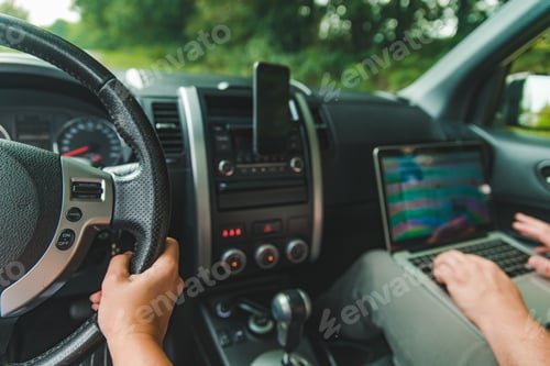 Preview: Couple In Car. Man Working On Laptop In Road Trip. Lifestyle Concept
