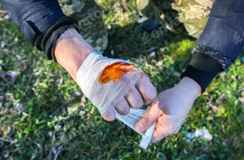 Preview: Man Is Putting Bandage On Bleeding Wound. Injured Hand. Tourist In The Nature. Infection Danger