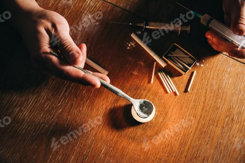 Preview: Man Shooting Heroin With Needle Syringe. Drugs Addict. Candle Burning With Matches And Cigarettes