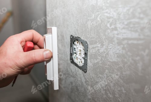 Preview: Man Is Installing The Socket. Electricity Maintenance Repair Works In The Flat. Restoration Indoors.