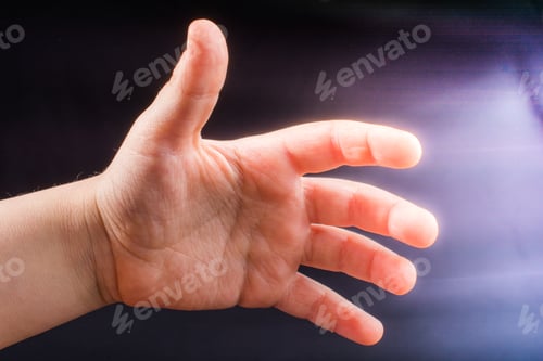 Preview: Five Fingers Of A Child Hand Partly Seen In Black Background