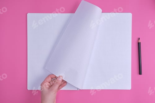 Preview: Empty Open Notebook In A Cell And A Female Hand, Pink Background, Top View