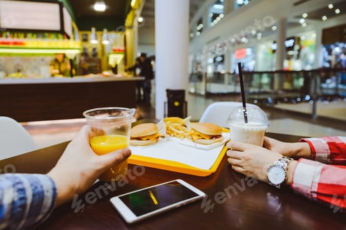 Preview: Couple Sit In Cafe Inside Mall Eat Burgers And Drink Juce