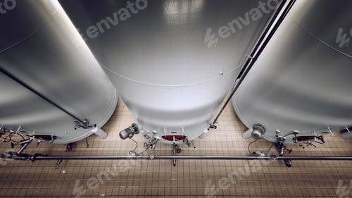 Preview: Large Industrial White Silos In Modern Factory Interior