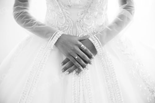 Preview: Bride Is Holding Hands With Golden Rings On Her Luxury Long Sleeve Dress. Beautiful Nails