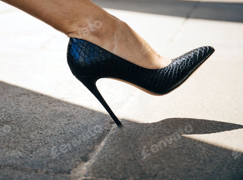 Preview: Black High Heel on the Pavement
