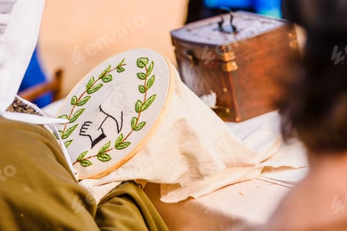 Preview: Young Woman Seamstress Sewing A Simple Drawing, Disguised As Medieval In A Traditional Craft