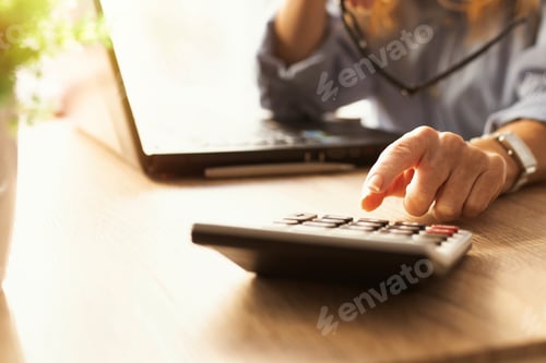 Preview: Business Woman Hand With Calculator And Computer On Desk