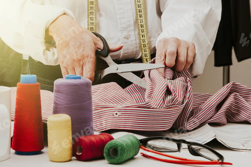 Preview: Dressmaker Working In The Sewing Workshop