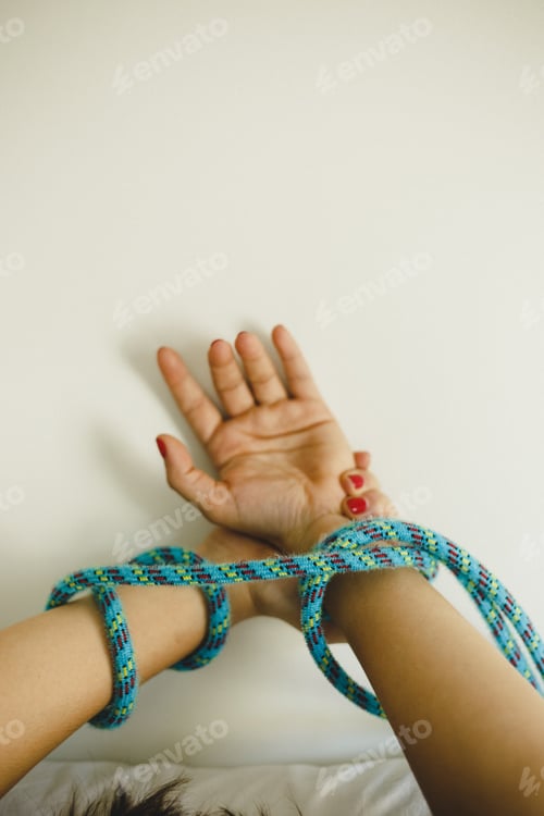 Preview: Hands Of Sexy And Young Woman Tied With Ropes To The Bed